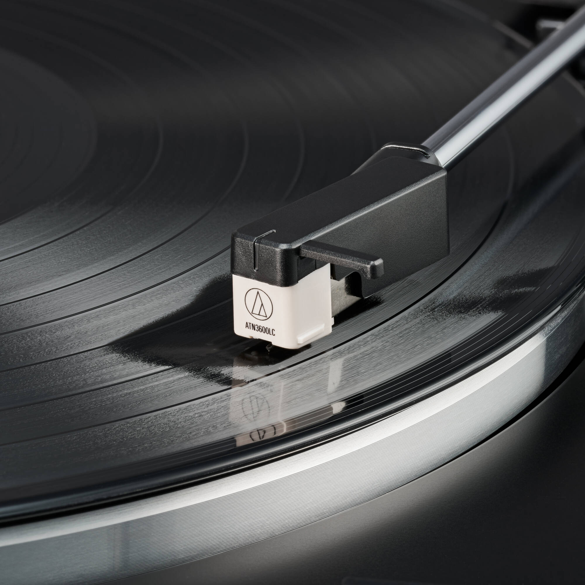 Audio-Technica ATN3600LC turntable stylus shown resting on a white background, highlighting its slim, precision-designed tip.