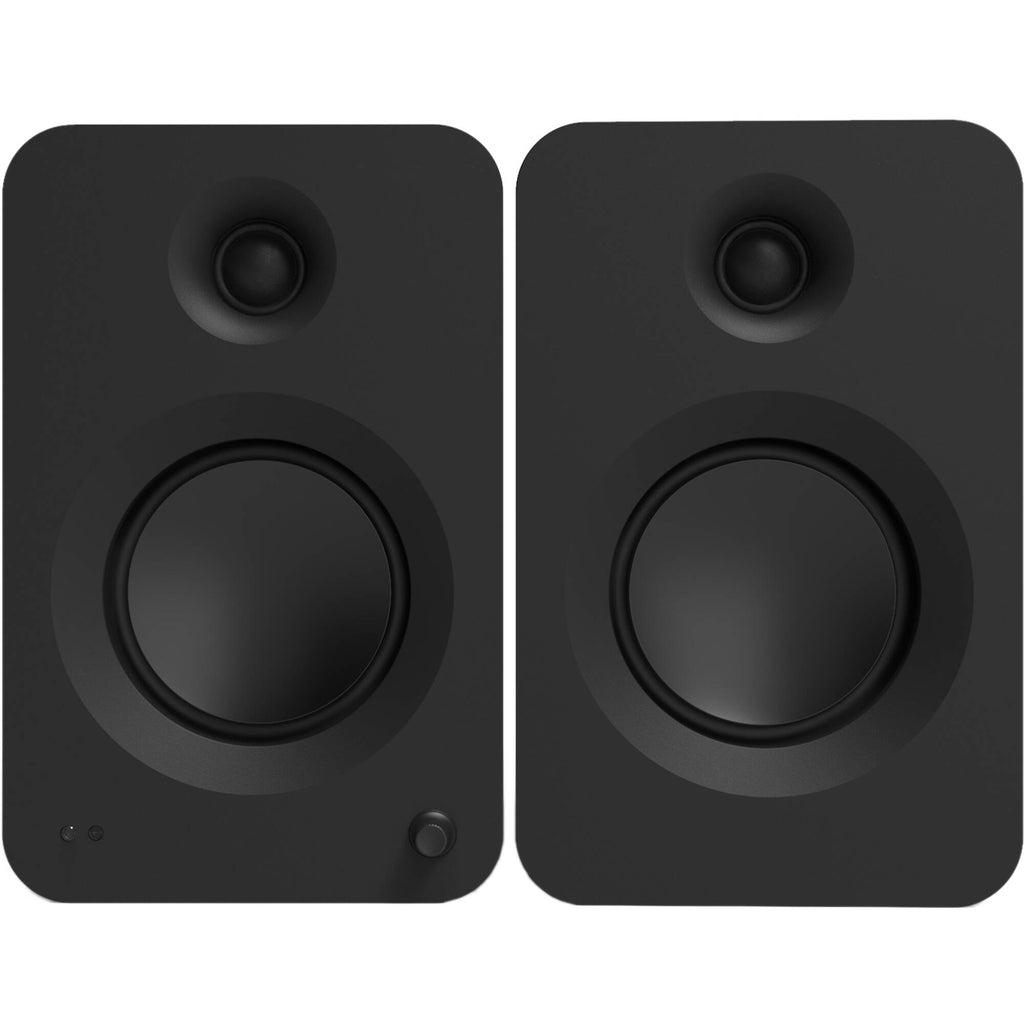 Kanto Audio Ren active bookshelf speakers with sleek black finish and modern design, shown on a wooden surface.