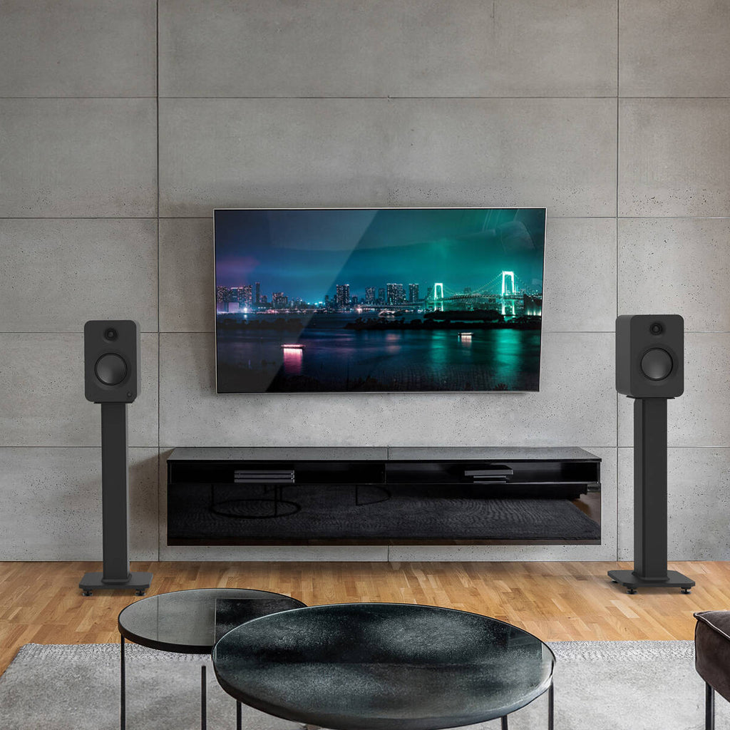 Kanto Audio Ren active bookshelf speakers with sleek black finish and modern design, featuring front-facing controls and drivers.
