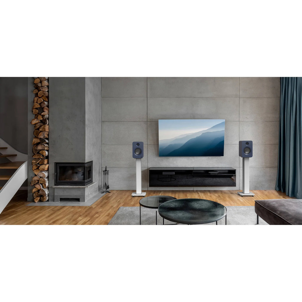 Kanto Audio Ren active bookshelf speakers with sleek black finish showing the front grille and control knobs.