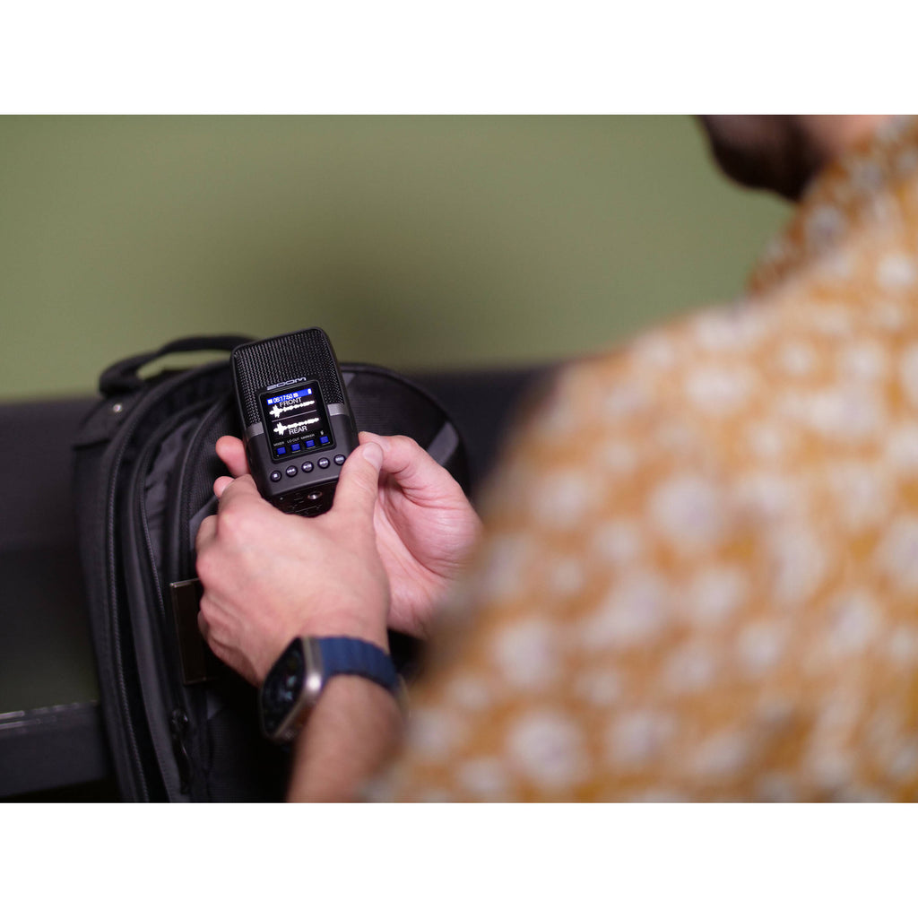 Zoom H2essential digital recorder with multiple microphone capsules and control buttons, ideal for high-quality audio recording.