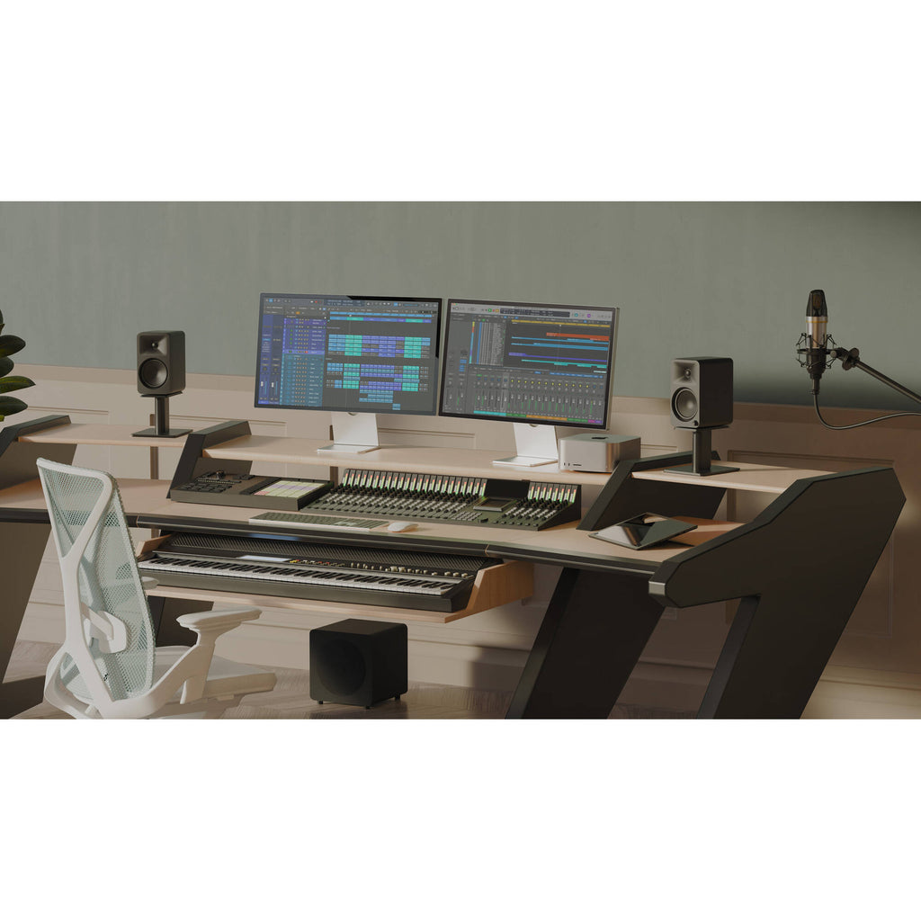 Kanto Audio Ora 4 desktop speakers shown on a desk with electronic devices and a modern workspace setup.