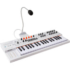 Arturia MiniFreak synthesizer with built-in vocoder, featuring a compact design, colorful interface, and various control knobs.