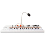 Arturia MiniFreak synthesizer with vocoder featuring knobs, keys, and display, showcasing its compact electronic music instrument design.
