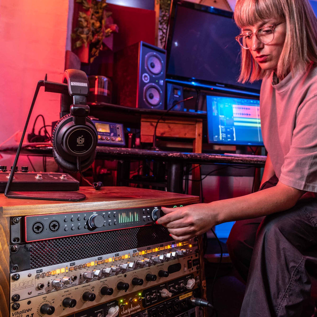 Focusrite Scarlett 18i20 4th Gen audio interface with multiple input and output ports, USB connection, and control knobs.