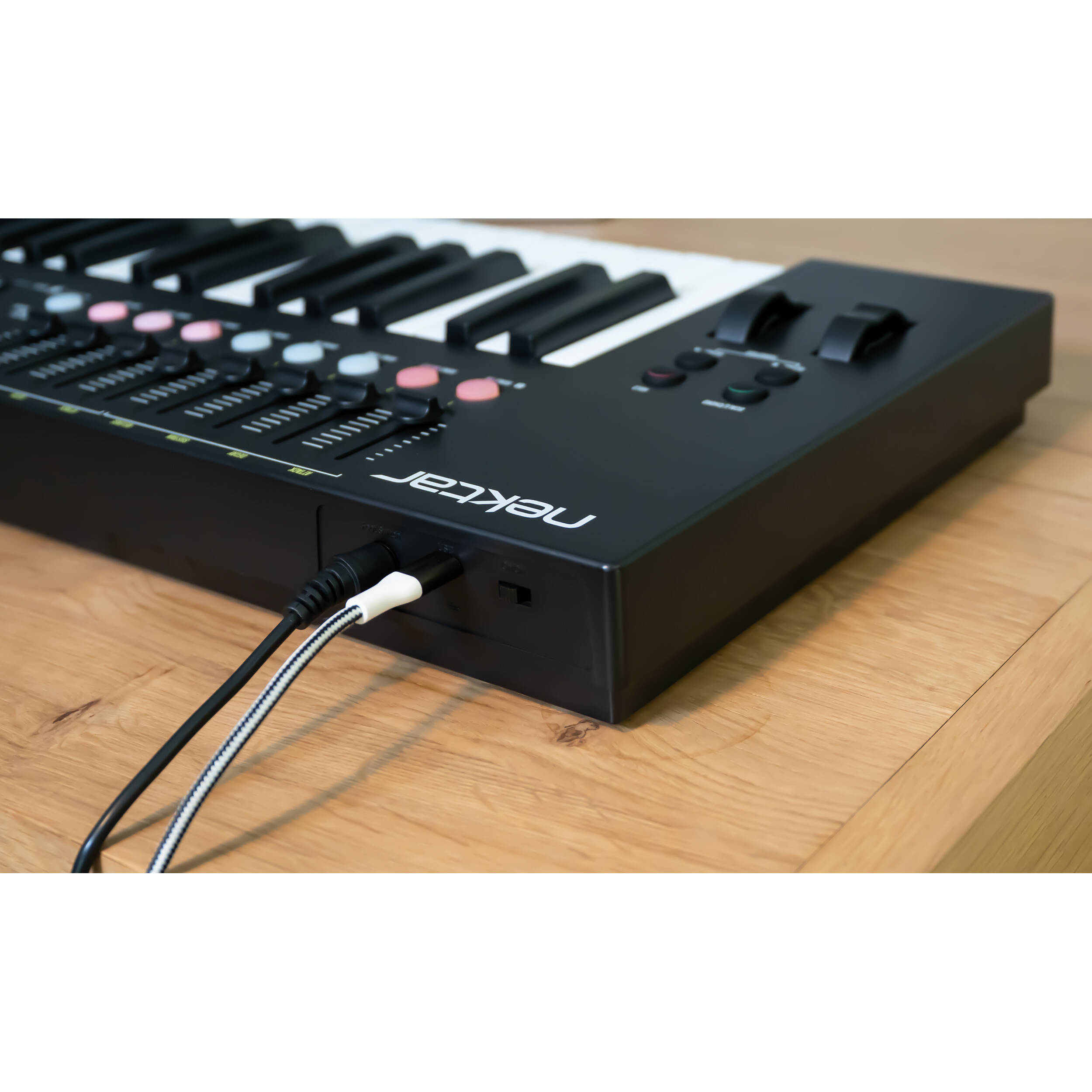 Nektar Impact LX49 MK3 midi keyboard with 49 keys, control knobs, and pads for music production and live performance.