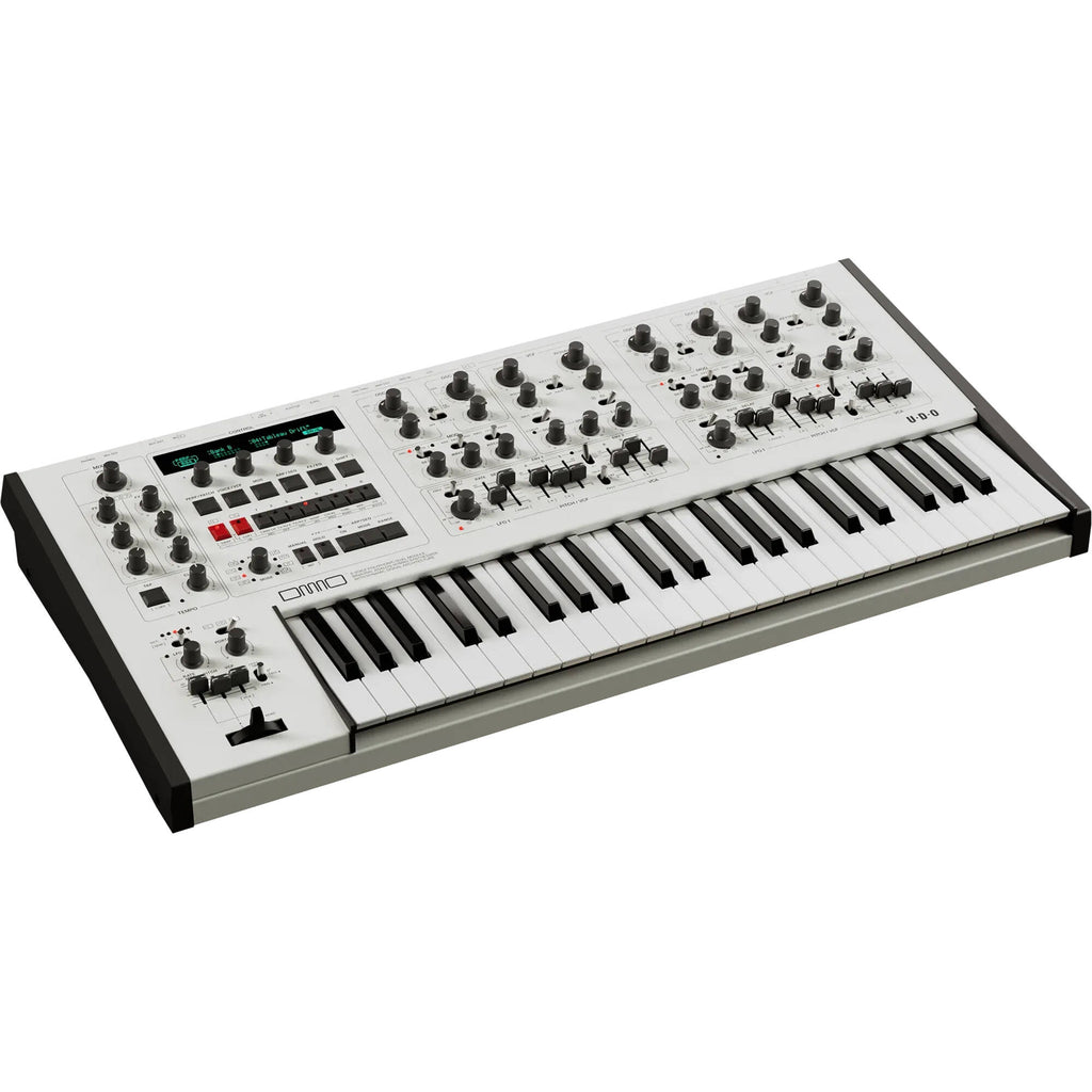 UDO Audio DMNO keyboard synthesizer with compact design, featuring various knobs and keys for versatile sound creation.