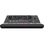 Alto Professional TMD16 digital mixer with multiple input channels and control knobs, set on a studio table.