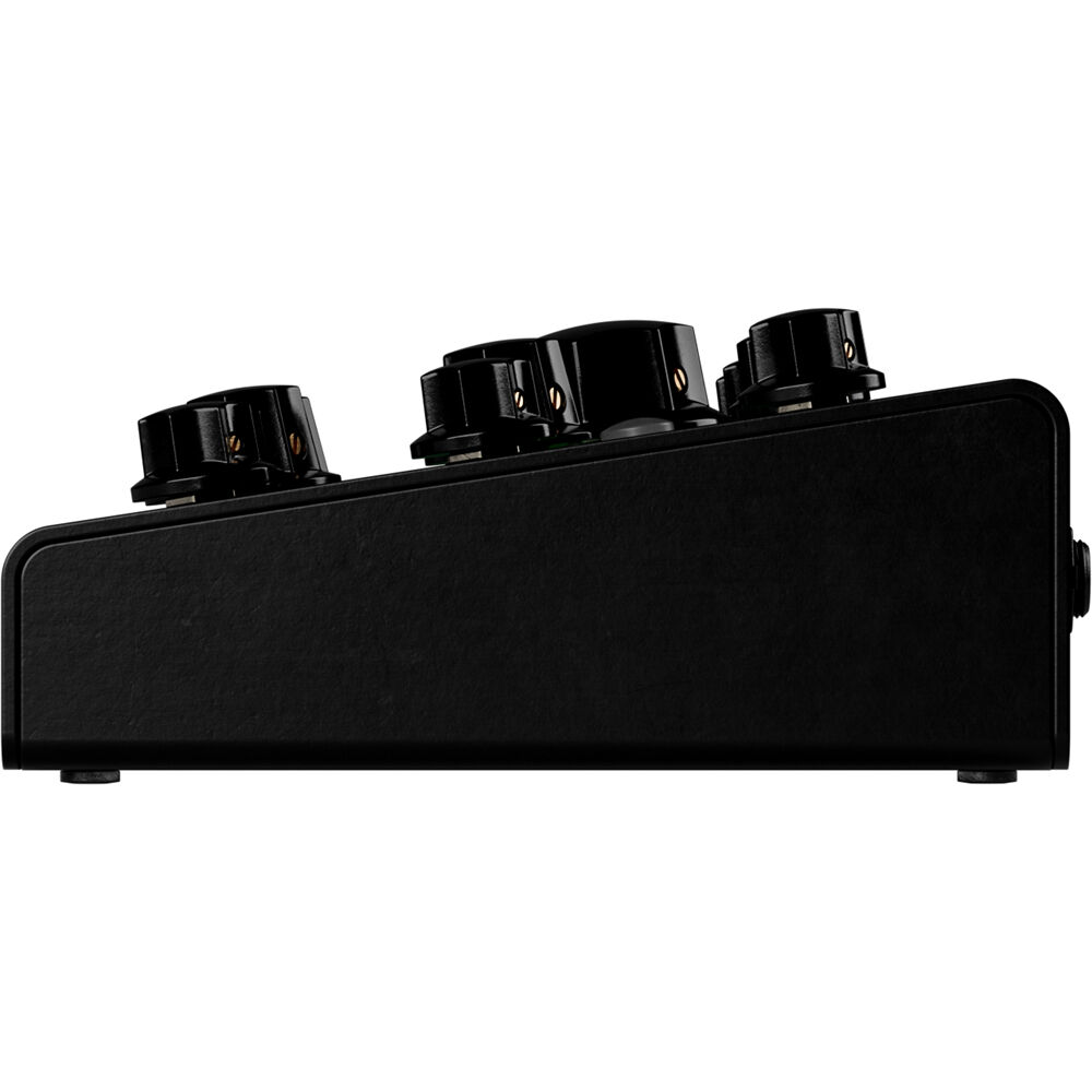 Erica Synths Xenodrive effects pedal with knobs and connectors on a wooden surface, showcasing its sleek design.