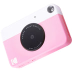 Kodak Printomatic instant compact camera with black body and lens, ready for quick photo printing and portable photography.