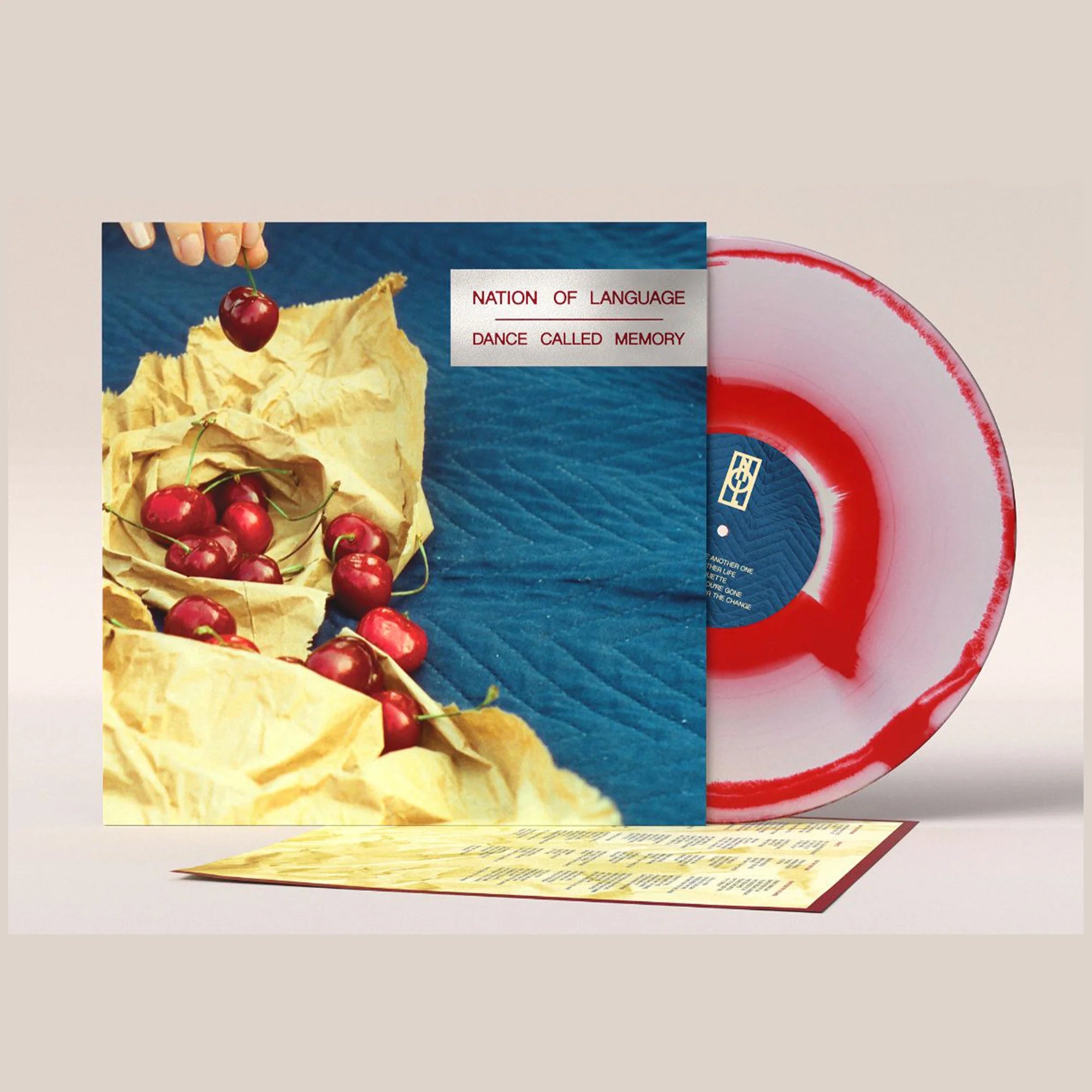 Nation of Language Dance Called Memory vinyl LP with white and red opaque corona, featuring album art and record in a protective sleeve.