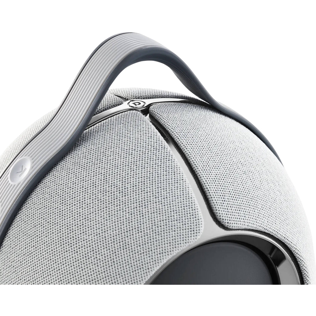 Devialet Mania portable speaker with sleek black design and touch controls, showcasing its compact and modern look.
