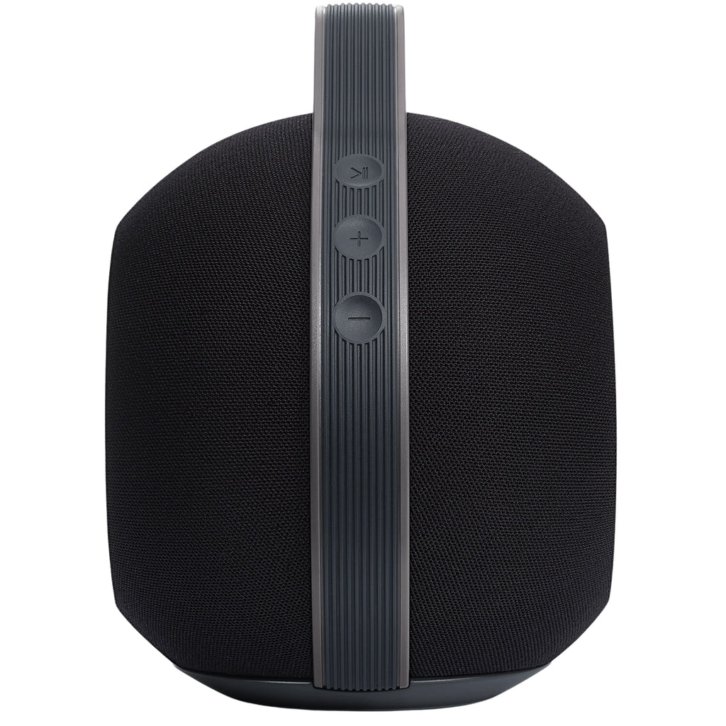 Devialet Mania portable speaker emitting sound, compact design with sleek black exterior and control buttons on top.