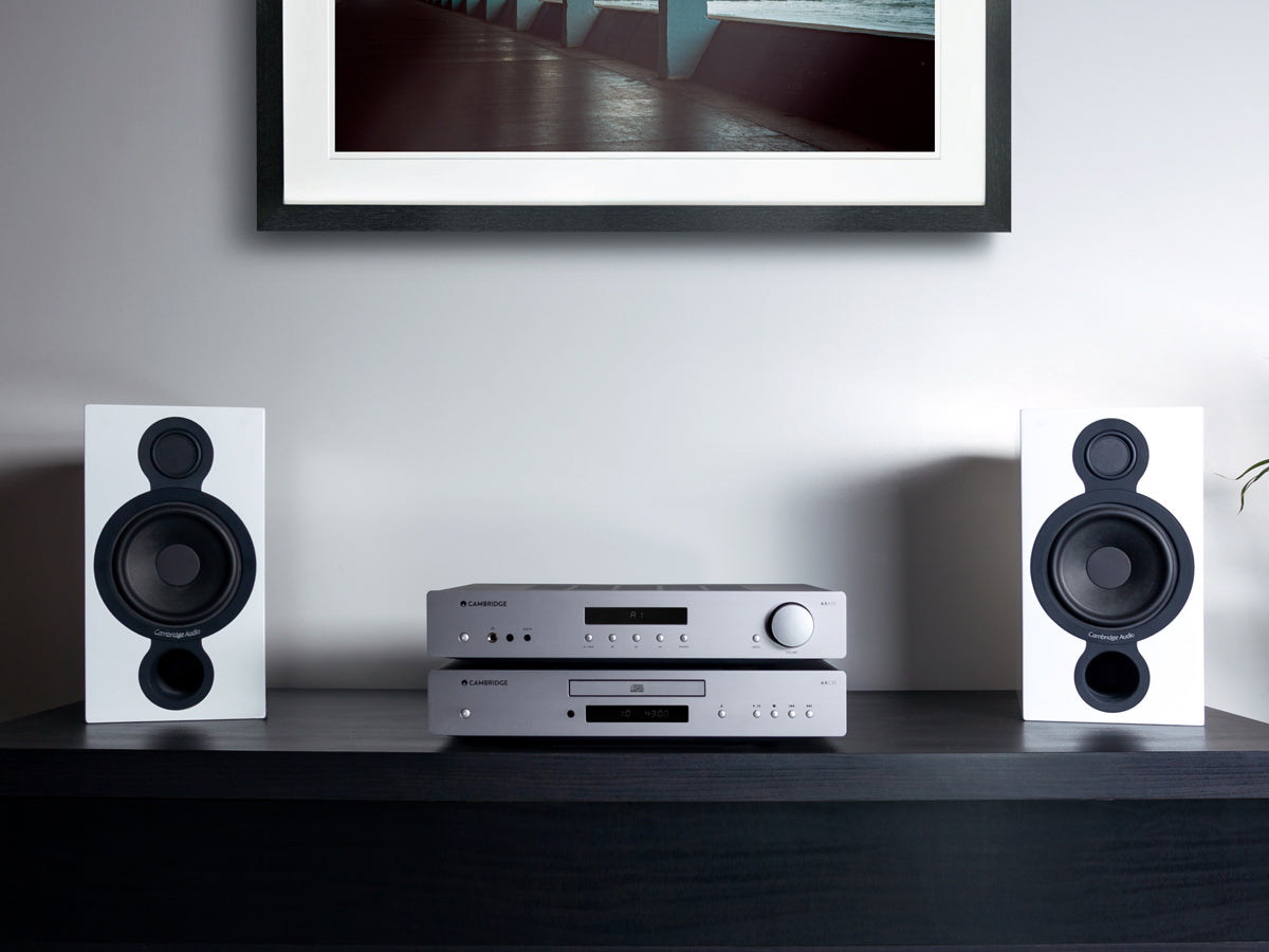 Cambridge Audio AXA35 stereo amplifier with black front panel and control knobs, showcasing a sleek, modern design.