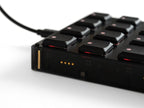 Close-up of Intech Studio BU16 Series 3 MIDI controller with knobs and buttons for music production.