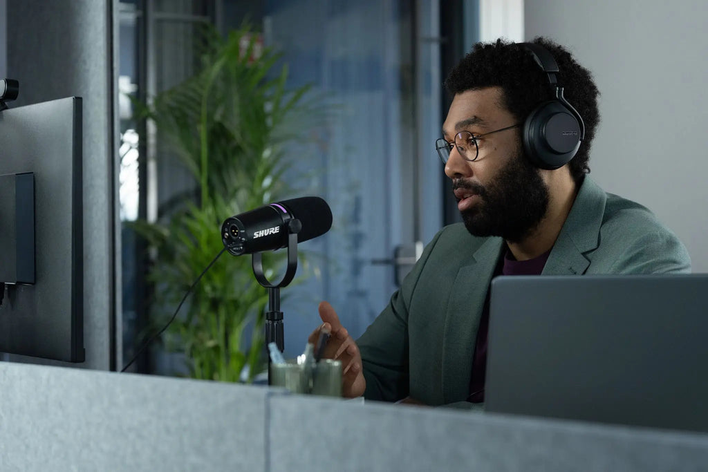 Shure MV7+ USB microphone with black body and built-in controls, ideal for podcasting and streaming.