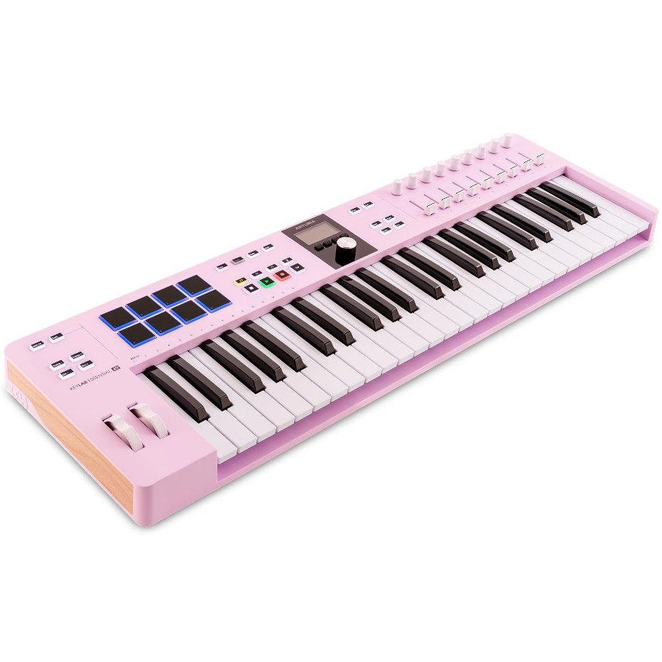 Arturia KeyLab Essential 49 MK3 MIDI keyboard with keys, controls, and connected cables for music production.