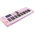 Arturia KeyLab Essential 49 MK3 MIDI keyboard with keys, controls, and connected cables for music production.