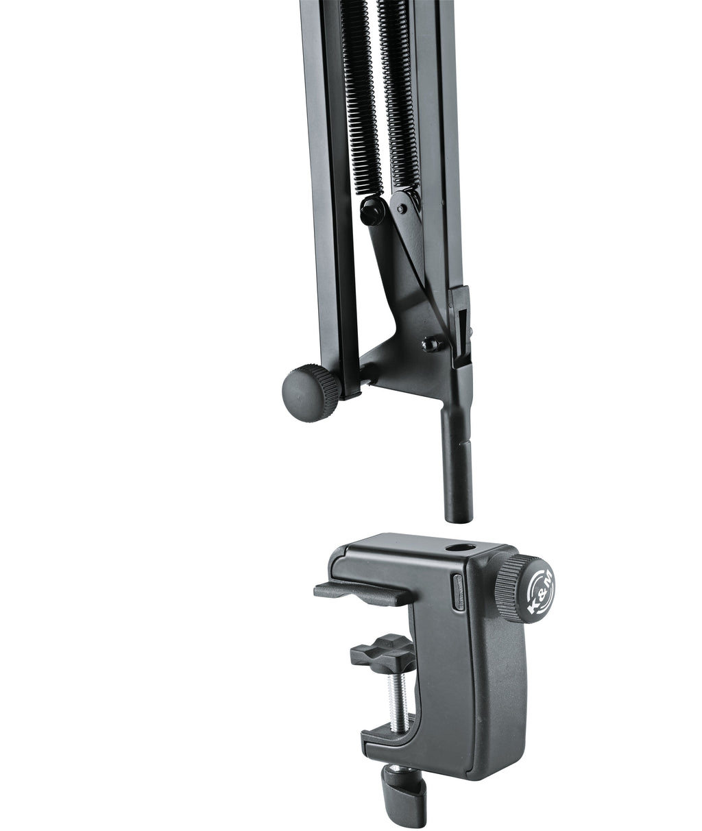 K&M 23840 broadcast microphone desk arm with adjustable metal boom and mounting clamp, ideal for recording and streaming setups.