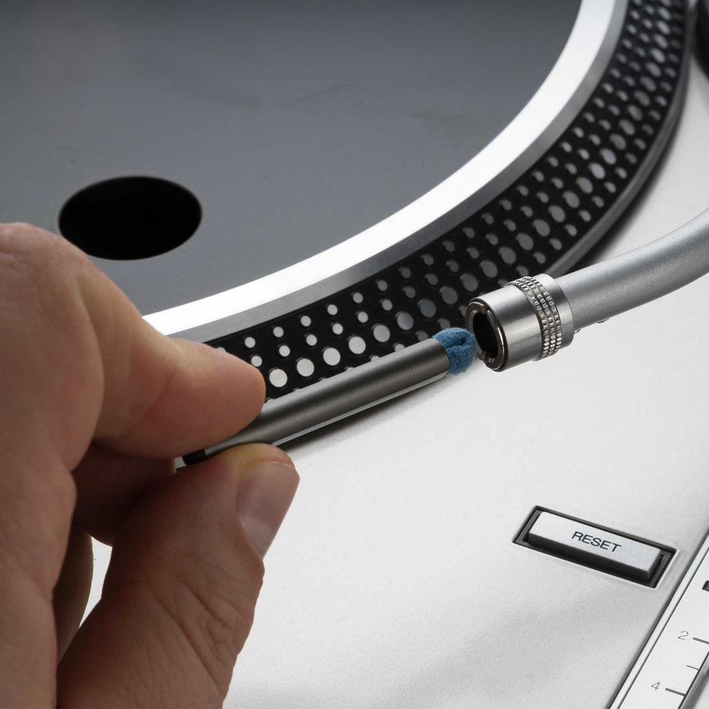 Reloop cartridge contact cleaning set with brush and cleaning solution for tonearm and cartridge maintenance.