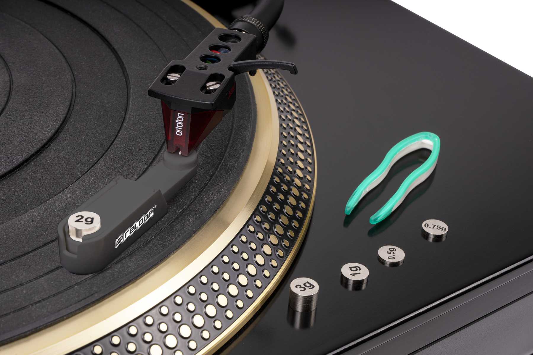 Reloop turntable cartridge mount and gauge set for precise cartridge installation and alignment on DJ turntables.