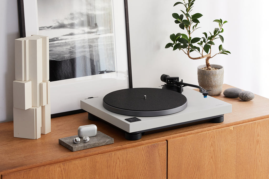 Technics SL-40CBT turntable with a sleek black design, featuring tonearm and platter for high-quality vinyl playback.