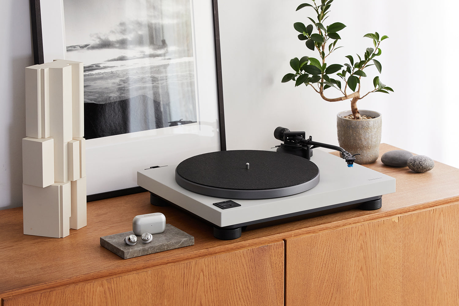 Technics SL-40CBT turntable with a sleek black design, featuring tonearm and platter for high-quality vinyl playback.