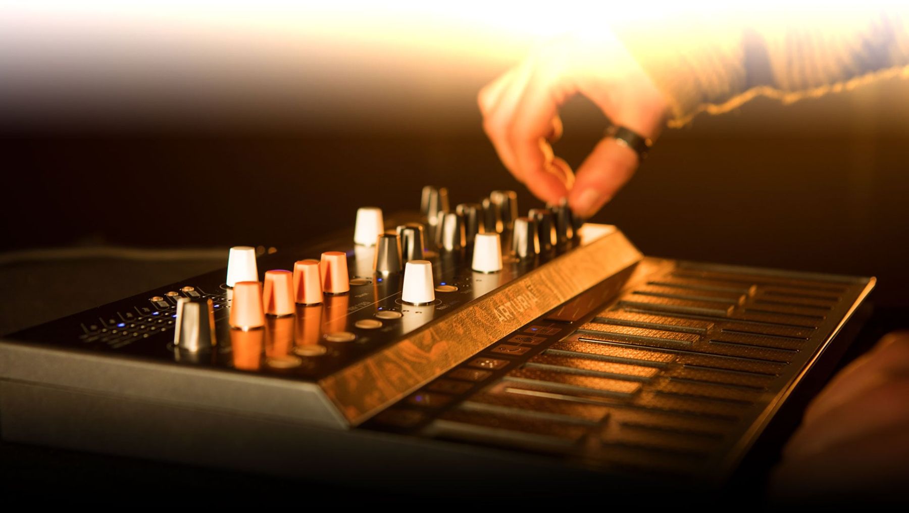 Arturia Microfreak synthesizer with compact design, multiple control knobs, and a digital interface for versatile sound creation.