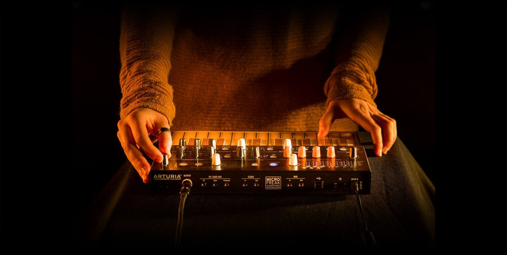 Arturia Microfreak synthesizer with its compact keyboard, knobs, and control panel, showcasing the versatile electronic music instrument.