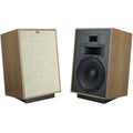 Klipsch Heresy IV floorstanding speakers with black cabinets and silver woofers, showcasing their sleek audio design.