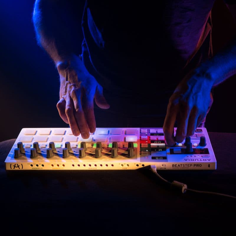 Arturia BeatStep Pro sequencer with multiple knobs, pads, and connection ports for music production and live performance.