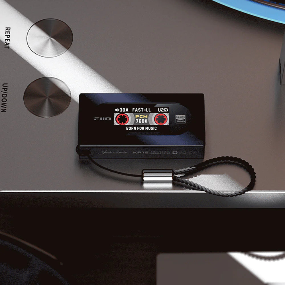 FiiO KA15 headphone amplifier and DAC with sleek black design and multiple input ports for high-quality audio.