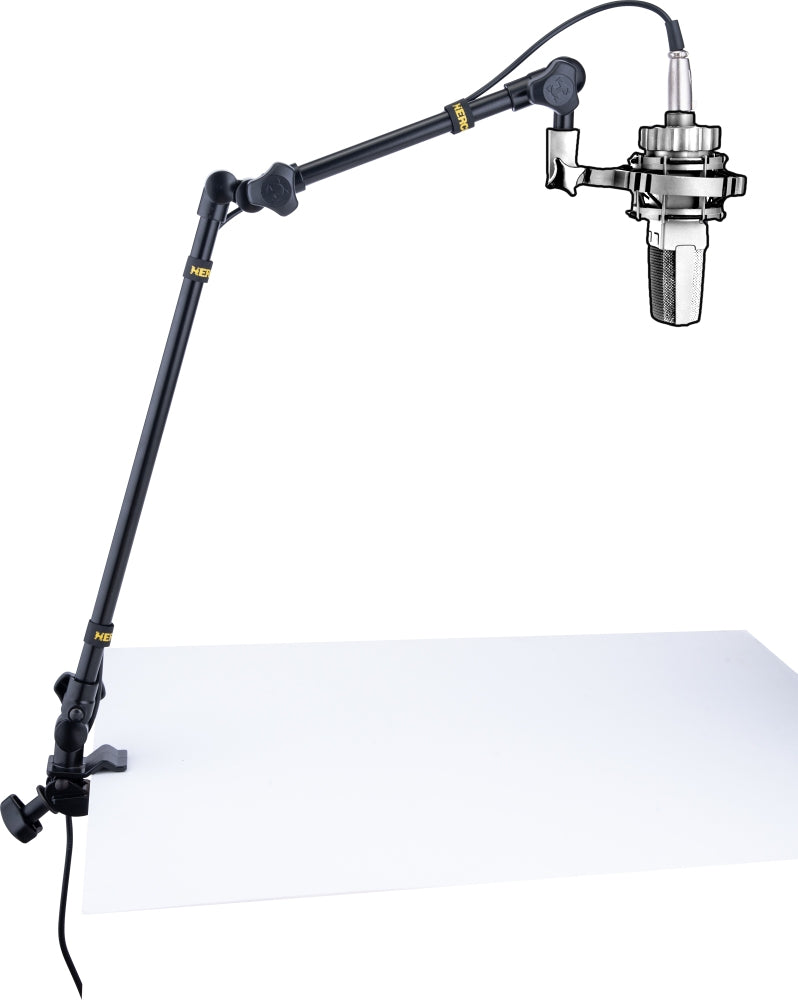 Hercules Stands DG107B broadcast microphone arm attached to a desk, adjustable metal boom for professional audio recording setup.