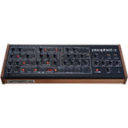 Sequential Prophet-5 Desktop synthesizer front angle view showing keyboard, control panel, and vintage electronic interface.
