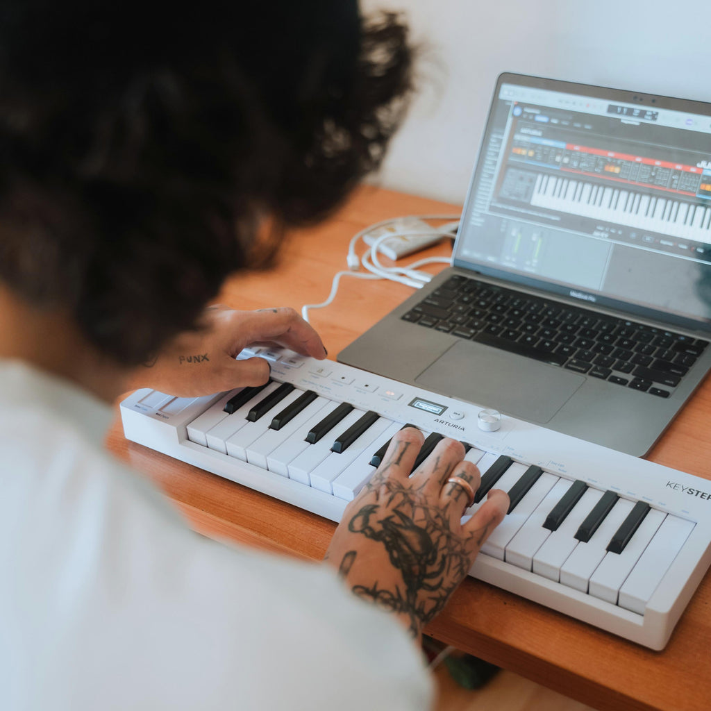 Arturia KeyStep MK2 MIDI controller with compact keyboard, knobs, and pads for music production and live performance.