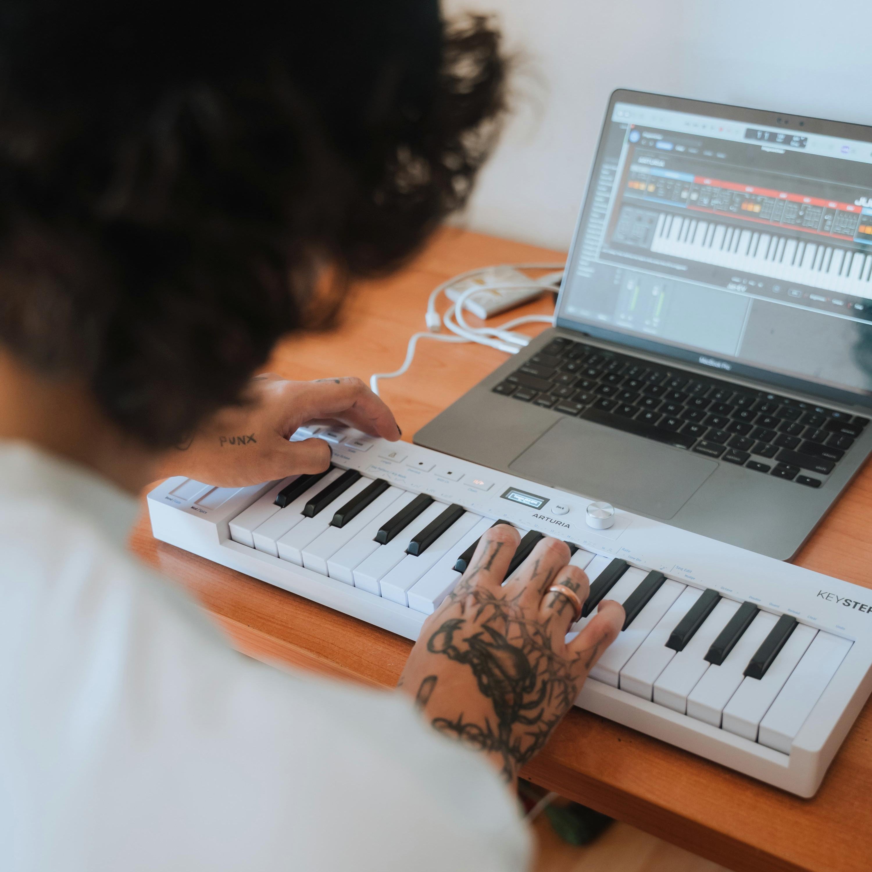 Arturia KeyStep MK2 MIDI controller with compact keyboard, knobs, and pads for music production and live performance.