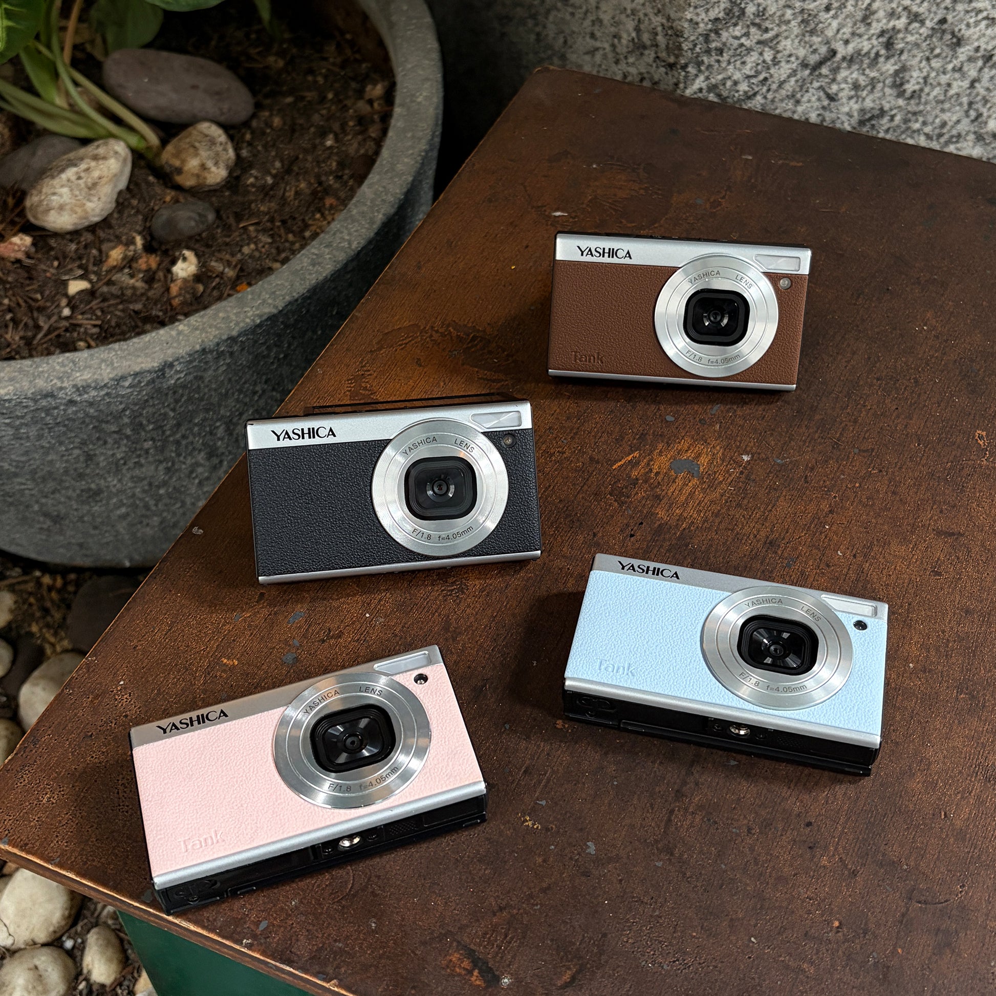 Yashica Tank instant compact camera with sleek design, featuring a lens and viewfinder for instant photography.