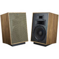 Klipsch Heresy IV floorstanding speakers with black finish and detailed speaker grille, showcasing a sleek audio design.