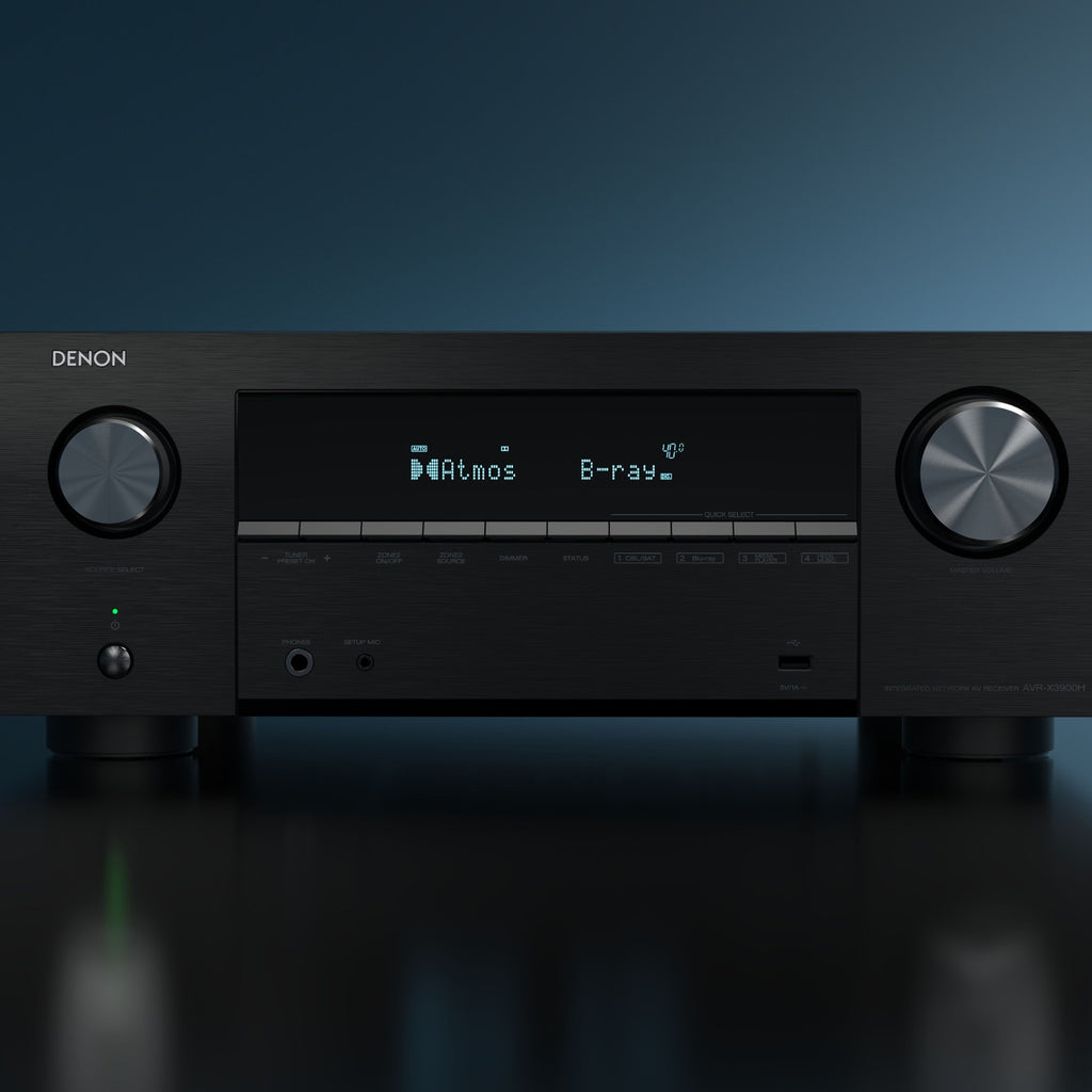 Denon AVC-X3900H stereo amplifier with black front panel, multiple input ports, and control knobs on top.
