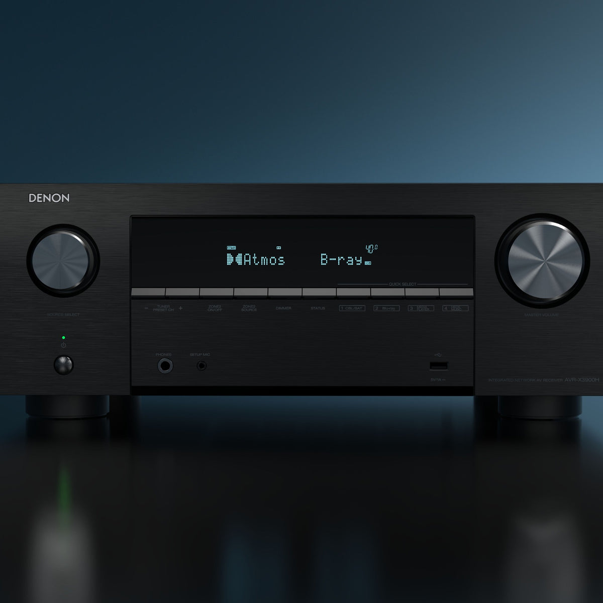 Denon AVC-X3900H stereo amplifier with black front panel, multiple input ports, and control knobs on top.