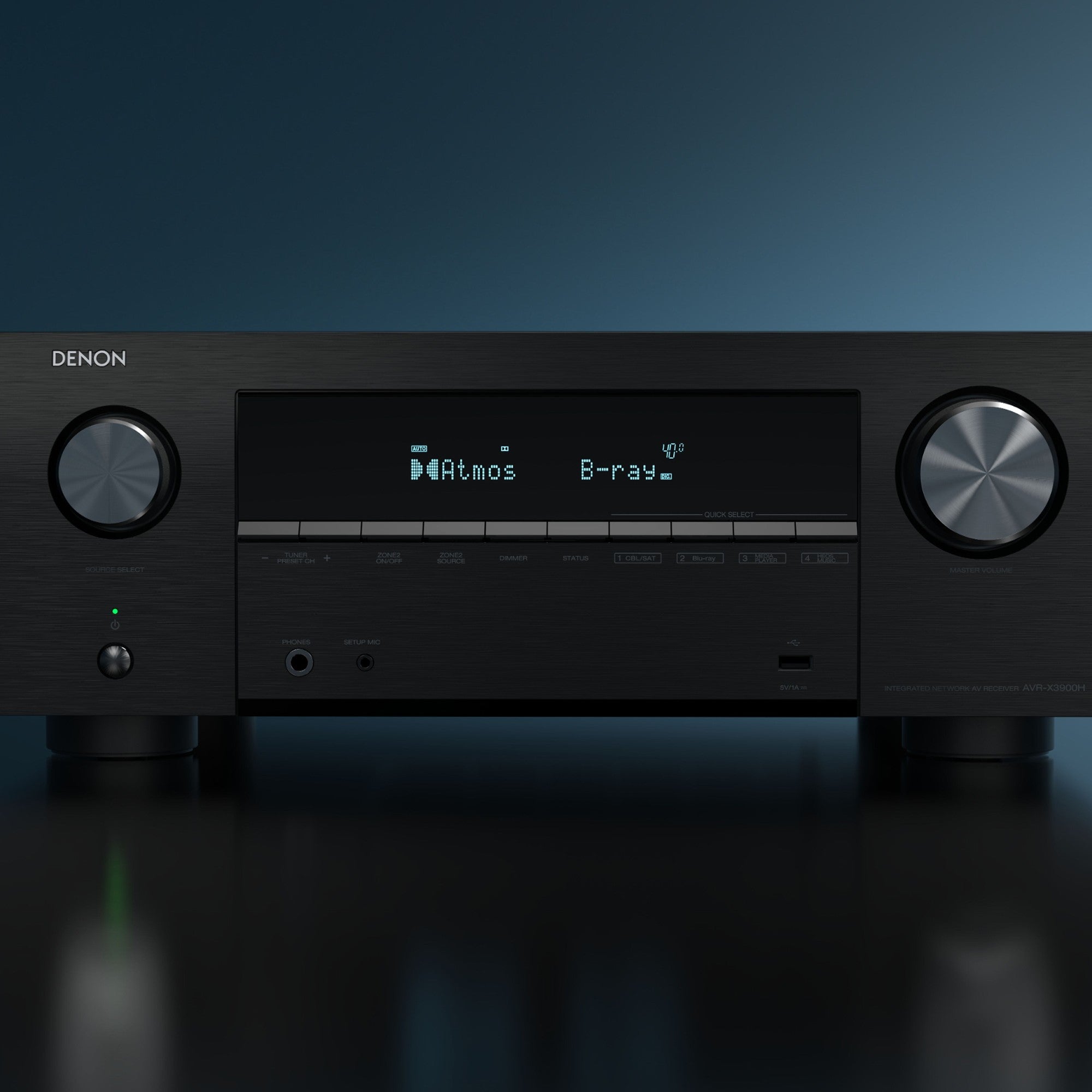 Denon AVC-X3900H stereo amplifier with black front panel, multiple input ports, and control knobs on top.