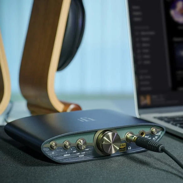 iFi Audio Zen Can 3 headphone amplifier and DAC with sleek black design and multiple input options, showcasing modern audio equipment.