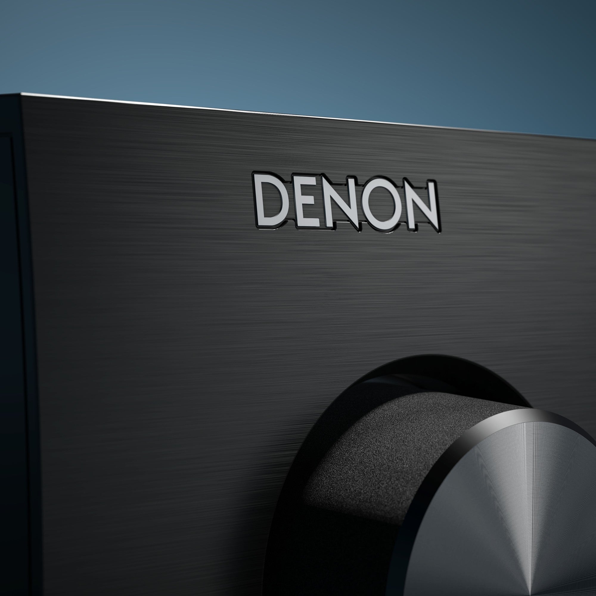 Denon AVC-X3900H stereo amplifier with multiple input ports and sleek black design, showcasing front panel controls and display.