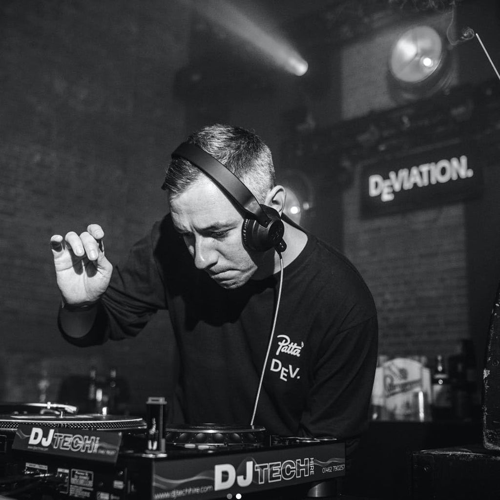 AIAIAI TMA-2 DJ V2 headphones in black with padded ear cups and adjustable headband, designed for professional DJ use.