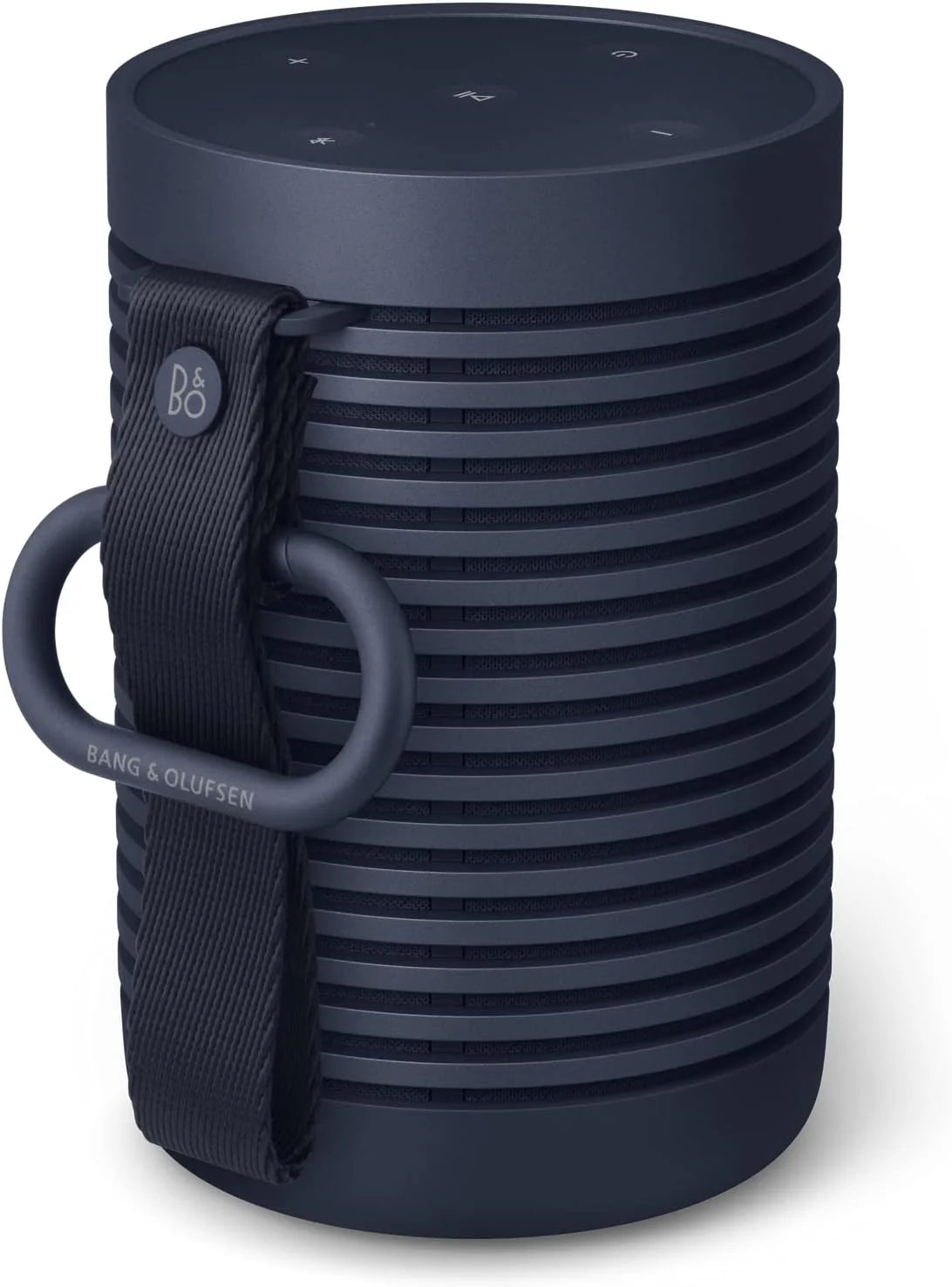 Bang & Olufsen Beosound Explore portable speaker in black with rugged design and fabric cover, shown outdoors.