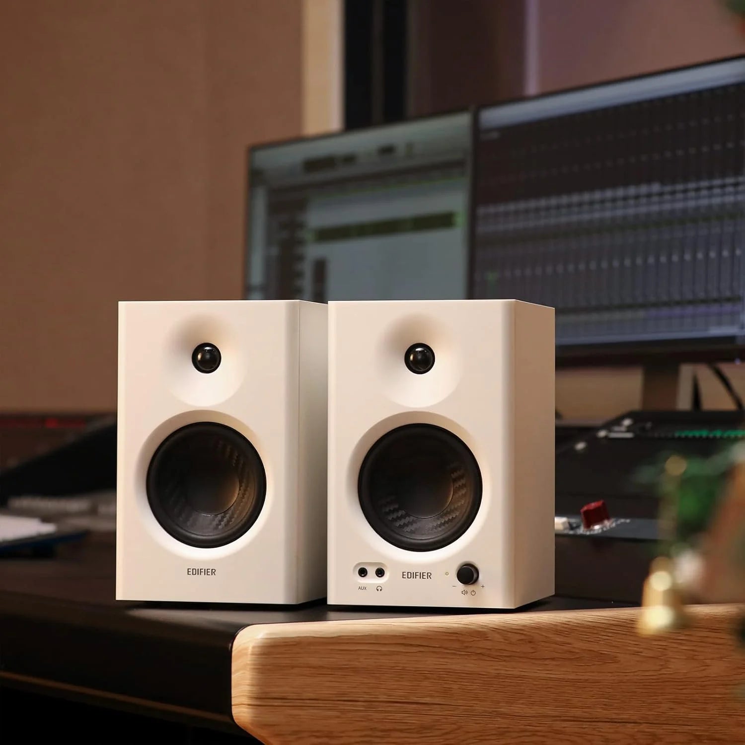 Edifier MR4 desktop speakers with sleek black design and compact size, featuring dual speaker units and modern audio technology.