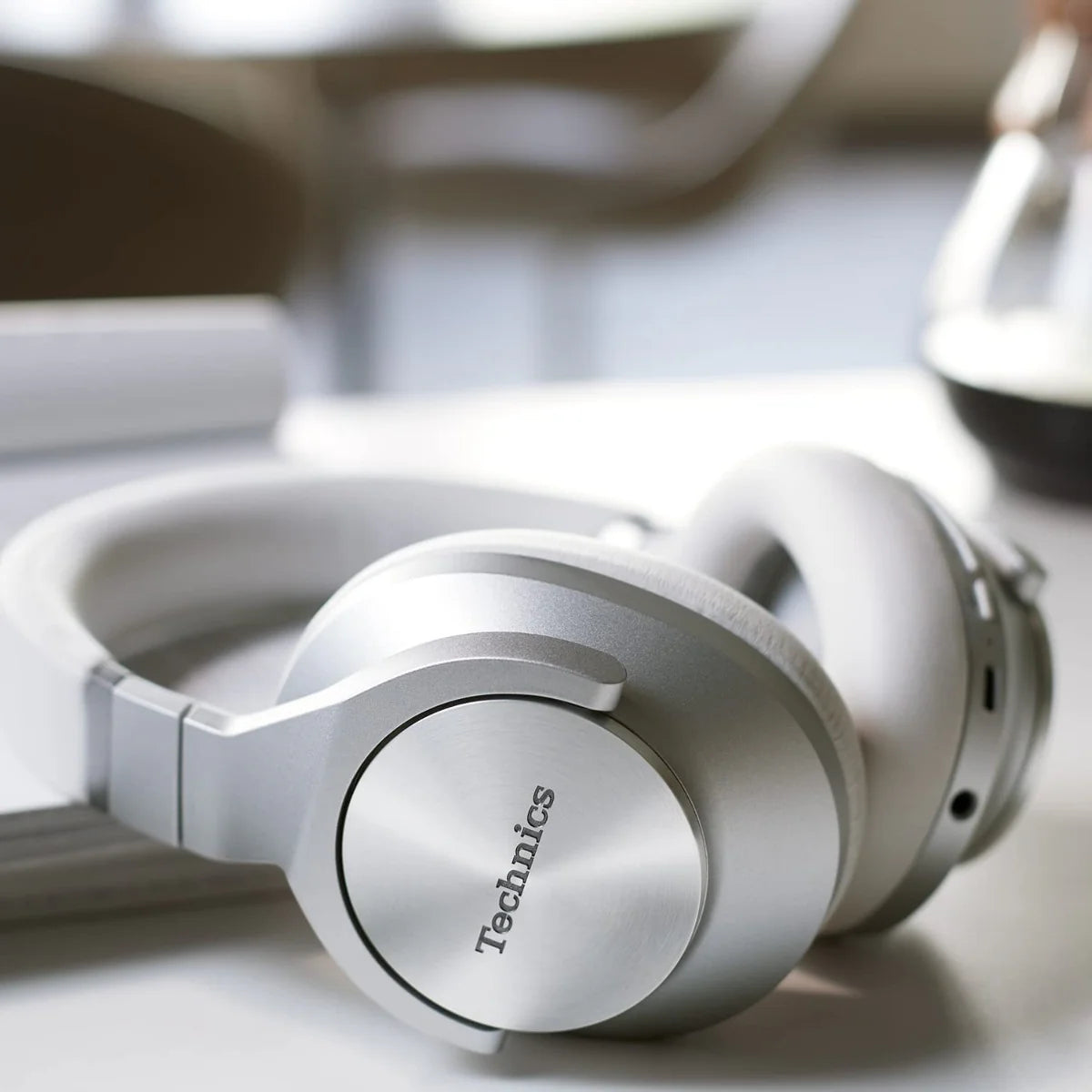 Technics EAH-A800 wireless headphones with over-ear design and sleek black finish, featuring cushioned ear cups for comfort.