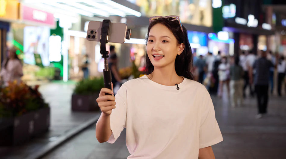 Hollyland Lark M2S Mini Combo wireless microphone system with camera and USB-C, featuring noise cancellation in a professional setting.