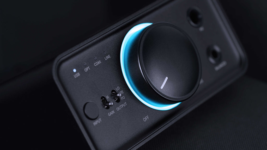 FiiO K7 BT headphone amplifier and DAC with multiple input ports and sleek black design, showcasing its front panel and controls.