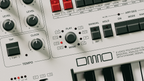 UDO Audio DMNO keyboard synthesizer with multiple play modes, featuring a sleek design and control knobs for versatile sound creation